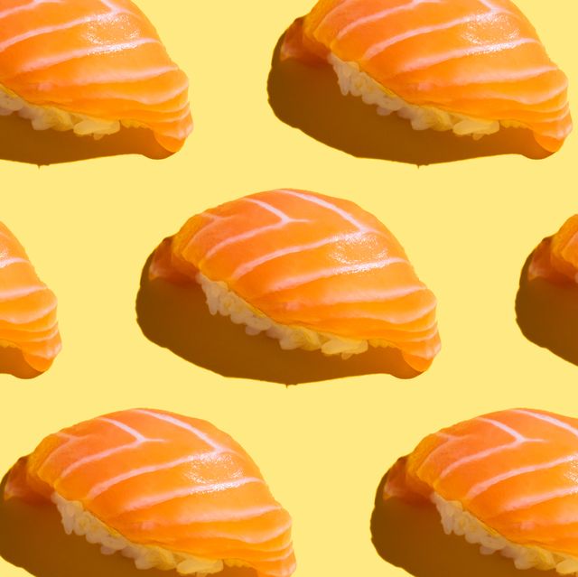 japanese food sushi pattern with salmon with hard shadow on bright yellow background