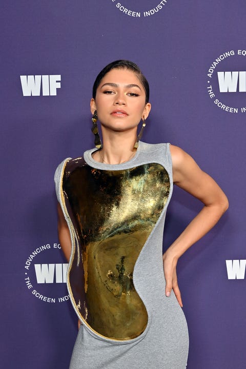 Zendaya in a gold breastplate and gray dress zendaya in a gold breastplate and gray dress