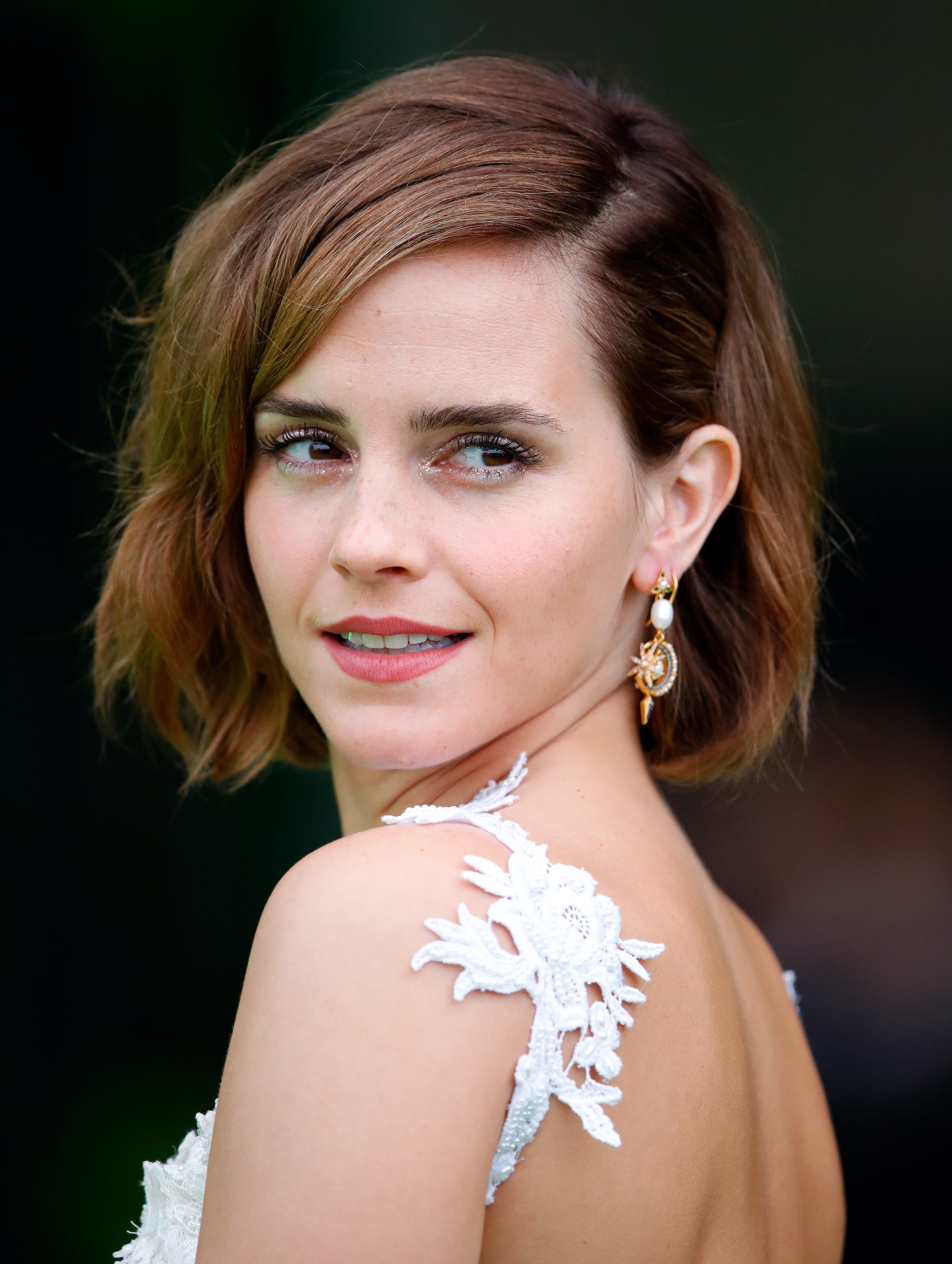 Emma Watson Returns to the Red Carpet in a Daring Backless Gown