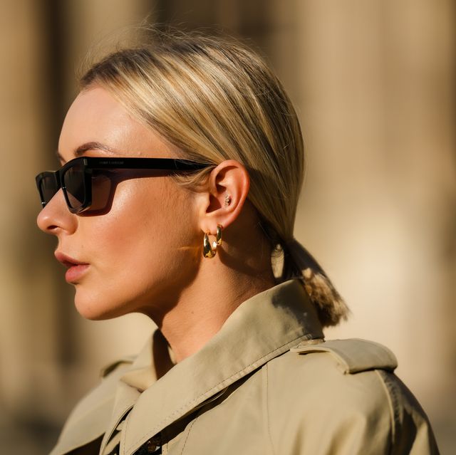 paris, france   november 11 justyna czerniak wears sunglasses from saint laurent ysl, a beige long trench coat from dorothee schumacher, golden earrings, during a street style fashion photo session, on november 11, 2021 in paris, france photo by edward berthelotgetty images