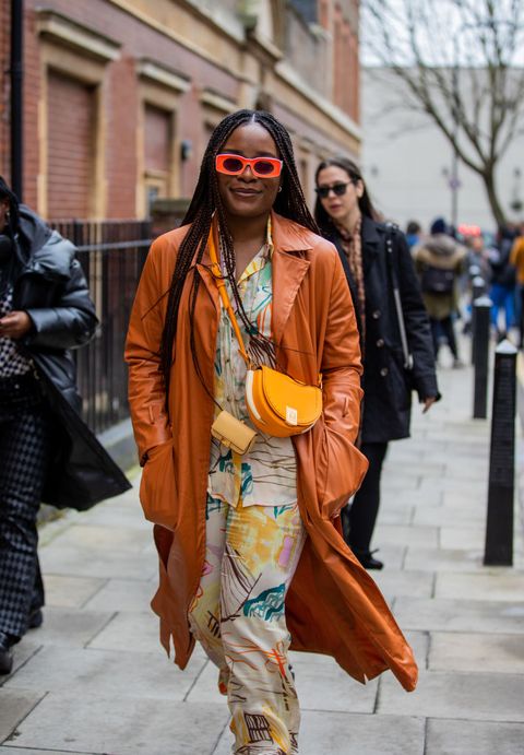 london, england   february 20 a guest is seen wearing fendi bag, suede brown coat, button shirt  pants with print outside 16arlington during london fashion week february 2022 on february 20, 2022 in london, england photo by christian vieriggetty images