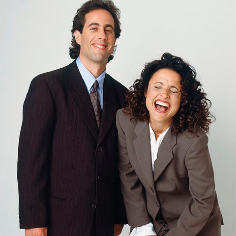 Suit, Formal wear, White-collar worker, Standing, Tuxedo, Businessperson, Gesture, Smile, Outerwear, Business,