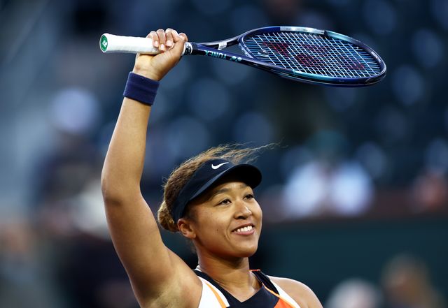 indian wells, california   march 10  naomi osaka of japan waves to the crowd after her three set victory against sloane stephens of the united states in their first round match on day 4 of the bnp paribas open at the indian wells tennis garden on march 10, 2022 in indian wells, california photo by clive brunskillgetty images
