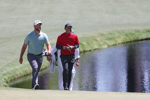 The Masters - Final Round augusta, georgia april 10 jon rahm of spain l and tiger woods walk to the 16th green during the final round of the masters at augusta national golf club on april 10, 2022 in augusta, georgia photo by gregory shamusgetty images