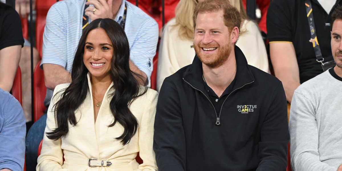 Meghan Markle Wears a White Belted Jacket and Pumps to Invictus Games