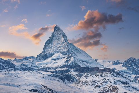 idyllic view of snowcapped matterhorn mountain peak famous snow covered landscape against sky during sunset beautiful snowy valley in alps during winter