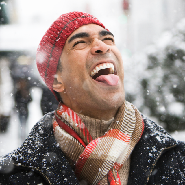 man catching snowflakes with tongue man catching snowflakes with tongue