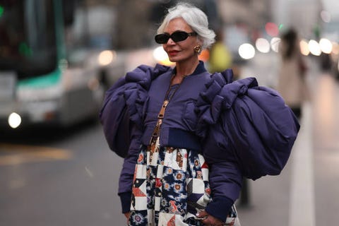 paris, france january 25 grece ghanem seen wearing a purple fendi sparkling baguette, a purple cropped puffer jacket, a patterned long dress and dark shades before the viktor rolf show on january 25, 2023 in paris, france photo by jeremy moellergetty images