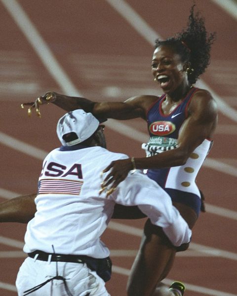 gail devers celebrates her gold medal in the 100 meters at the 1996 olympics in atlanta