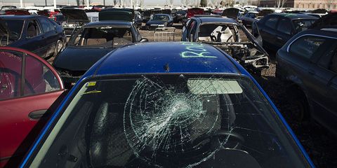 a smashed windscreen is seen on a scrapped vehicle in the yard of the desguaces la torre scrapyard in madrid, spain, on thursday, dec 13, 2012 spain has completed the debt sales it planned for this year and started raising funds for 2013, buying time for prime minister mariano rajoy as he decides whether to seek a european bailout photographer angel navarretebloomberg via getty images