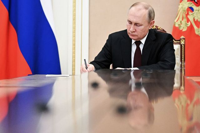 russia's president vladimir putin writes as he chairs a meeting on economic issues in moscow on february 17, 2022 photo by alexey nikolsky  sputnik  afp photo by alexey nikolskysputnikafp via getty images