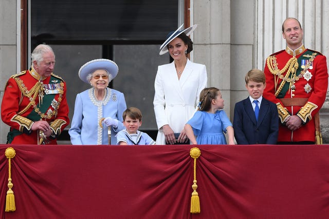 topshot   britains queen elizabeth ii 2l stands with from left, britains prince charles, prince of wales, britains prince louis of cambridge, britains catherine, duchess of cambridge, britains princess charlotte of cambridge , britains prince george of cambridge, britains prince william, duke of cambridge, to watch a special flypast from buckingham palace balcony following the queens birthday parade, the trooping the colour, as part of queen elizabeth iis platinum jubilee celebrations, in london on june 2, 2022   huge crowds converged on central london in bright sunshine on thursday for the start of four days of public events to mark queen elizabeth iis historic platinum jubilee, in what could be the last major public event of her long reign photo by daniel leal  afp photo by daniel lealafp via getty images