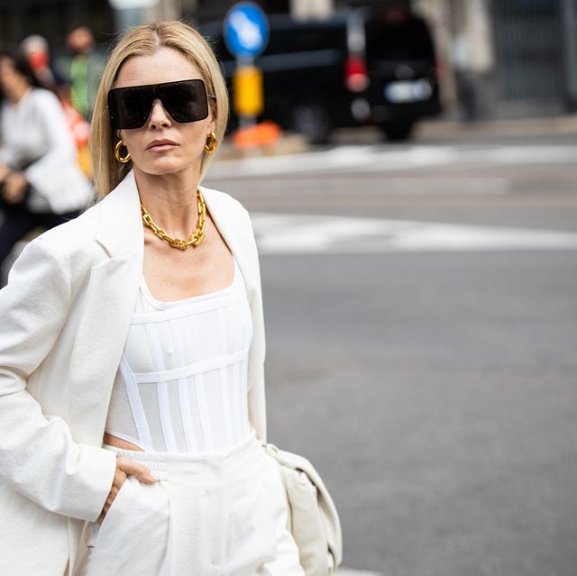 milan, italy   september 23 elizabeth sulcer, wearing a white top, white suit and white bag, poses ahead of the max mara fashion show during the milan fashion week   spring  summer 2022 on september 23, 2021 in milan, italy photo by claudio laveniagetty images