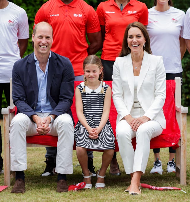 britains princess charlotte of cambridge c, britains prince william, duke of cambridge l and britains catherine, duchess of cambridge r pose for a photograph during a visit to sportsaid house on day five of the commonwealth games in birmingham, central england, on august 2, 2022 the duchess became the patron of sportsaid in 2013, team england futures programme is a partnership between sportsaid, sport england and commonwealth games england which will see around 1,000 talented young athletes and aspiring support staff given the opportunity to attend the games and take a first hand look behind the scenes photo by chris jackson pool afp photo by chris jacksonpoolafp via getty images