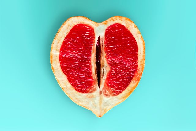top view heart shaped ripe juicy grapefruit  isolated on a blue background