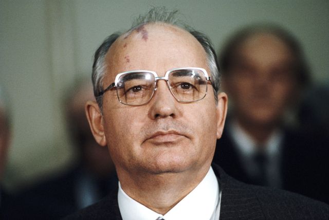 mikhail gorbachev, russian politburo member and second in line at the kremlin, announces the death of soviet defence minister marshal dmitri ustinov, before departing from edinburgh airport for russia, in edinburgh, scotland, on friday, 21 december, 1984 gorbachev was on a week long trip to britain in december photo by bryn coltongetty images