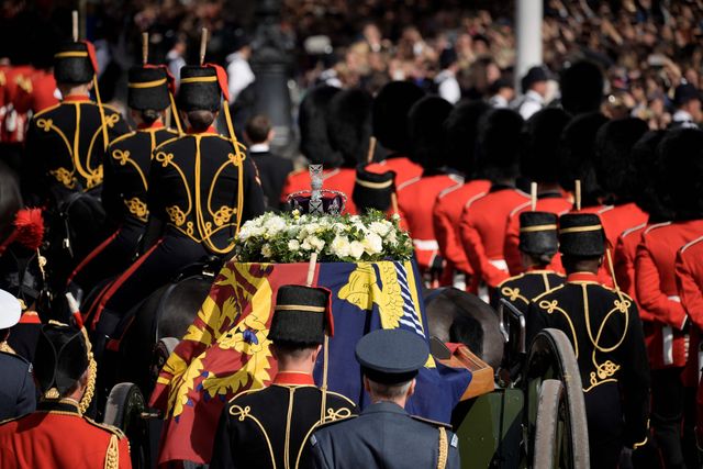the coffin of queen elizabeth ii, adorned with a royal standard and the imperial state crown and pulled by a gun carriage of the kings troop royal horse artillery, is seen during a procession from buckingham palace to the palace of westminster, in london on september 14, 2022   queen elizabeth ii will lie in state in westminster hall inside the palace of westminster, from wednesday until a few hours before her funeral on monday, with huge queues expected to file past her coffin to pay their respects photo by vadim ghirda  pool  afp photo by vadim ghirdapoolafp via getty images
