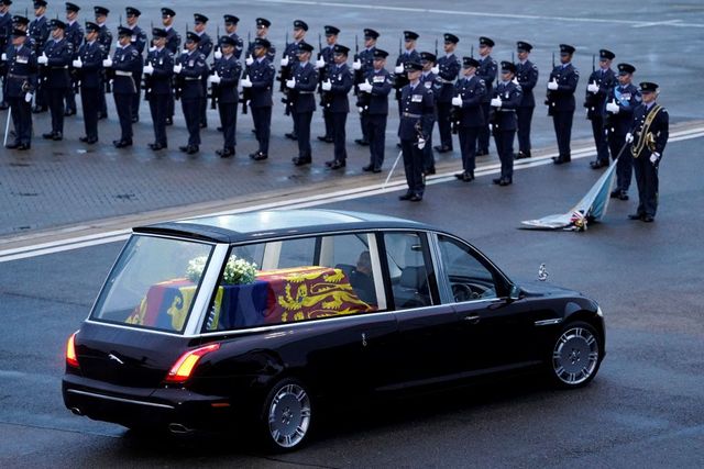 topshot   the queens colour squadron, raf, stand by as the coffin of queen elizabeth ii is taken away in the royal hearse from the royal air force northolt airbase on september 13, 2022, to travel to buckingham palace   mourners in edinburgh filed past the coffin of queen elizabeth ii through the night, before the monarchs coffin returns to london to lie in state ahead of her funeral on september 19 photo by andrew matthews  pool  afp photo by andrew matthewspoolafp via getty images