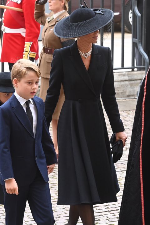 london, england   september 19 princess charlotte of wales, prince george of wales and catherine, princess of wales walk behind the queen's funeral cortege borne on the state gun carriage of the royal navy as it proceeds towards westminster abbey on september 19, 2022 in london, england elizabeth alexandra mary windsor was born in bruton street, mayfair, london on 21 april 1926 she married prince philip in 1947 and ascended the throne of the united kingdom and commonwealth on 6 february 1952 after the death of her father, king george vi queen elizabeth ii died at balmoral castle in scotland on september 8, 2022, and is succeeded by her eldest son, king charles iii photo by geoff pugh   wpa poolgetty images