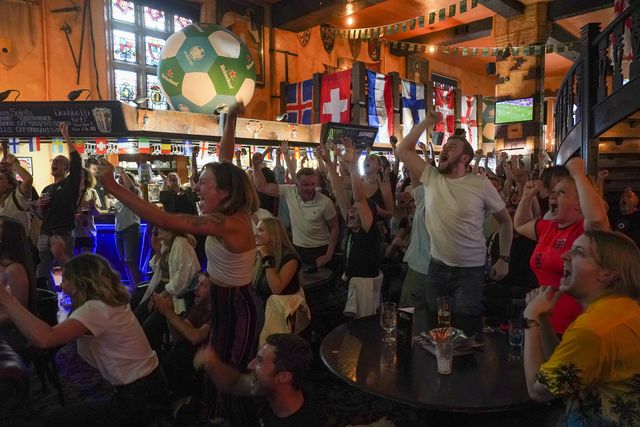 brighton, england   july 26 football fans celebrate englands first goal in the england v sweden semi final of the womens euros 2022 being played at bramall lane in sheffield, at ye olde king and queen pub on july 26, 2022 in brighton, england england take on sweden in the semi final of the womens euros 2022 photo by chris eadesgetty images