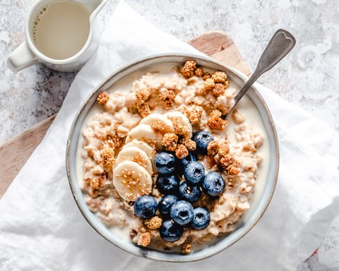 Creamy bowl of oatmeal with banana, blueberries, blackberries and sesame seeds creamy bowl of oatmeal with banana, blueberries, blackberries and sesame seeds