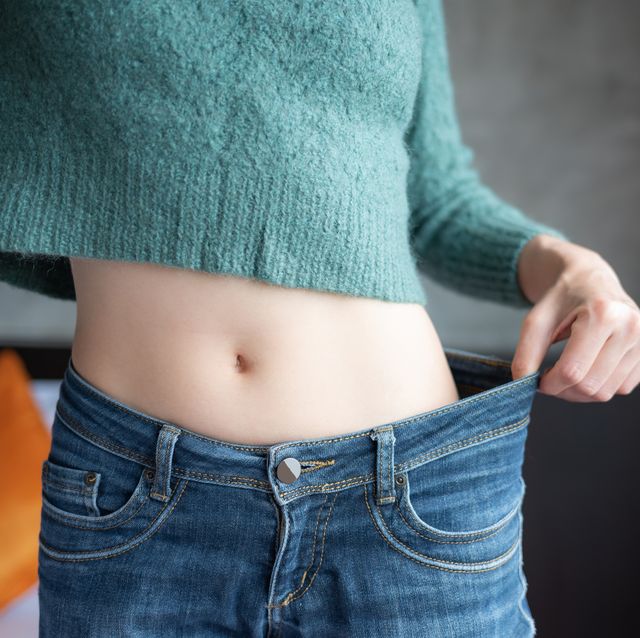 conceptual shot of woman showing her diet results