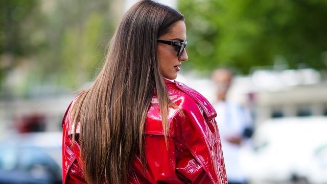 paris, france july 05 gabrielle caunesil wears black sunglasses, gold earrings, a red shiny varnished vinyl zipper epaulets belted long sleeves short dress, gold rings, outside alexandre vauthier, during paris fashion week haute couture fall winter 2022 2023, on july 05, 2022 in paris, france photo by edward berthelotgetty images