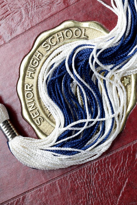 High School Year Book mortar board tassel on high school year book