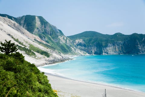 sand dune landslide caused by earthquake and blue water, takowan beach, kozu island of izu islands, tokyo, japan