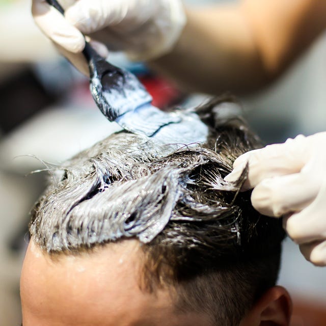 man in a hair salon coloring hair