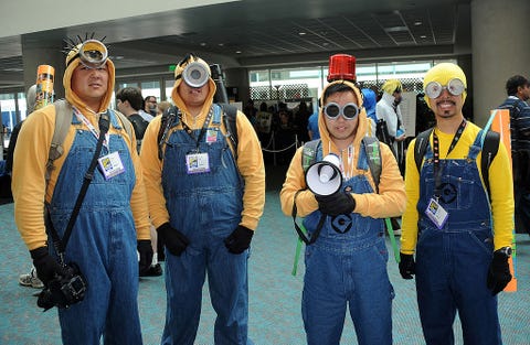 cosplayers dressed in yellow sweatshirts and overalls as minions from despicable me attend comic con international