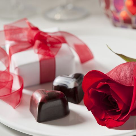 several more in this series perfect red rose, gift box, and heart shaped chocolates in a table setting very shallow dof