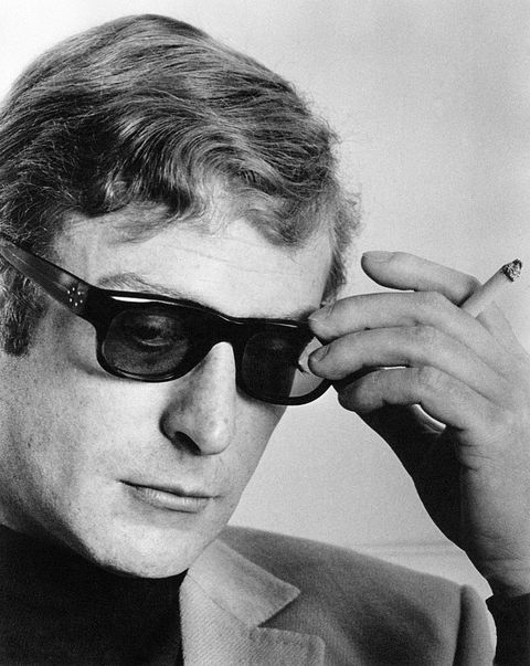 Micheal Caine with a cigarette in his hand during an interview