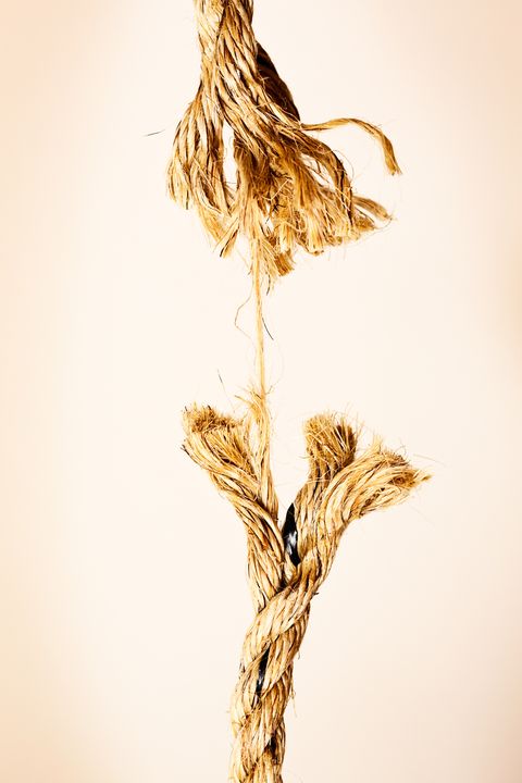 Someone has reached breaking point symbolized by snapping rope.