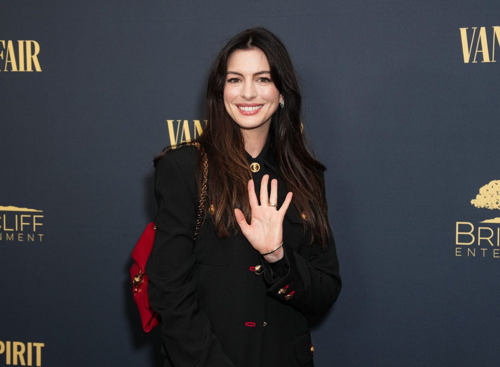 Anne Hathaway Plays With Proportions in a Leather Minidress and Floor-Length Gabardine