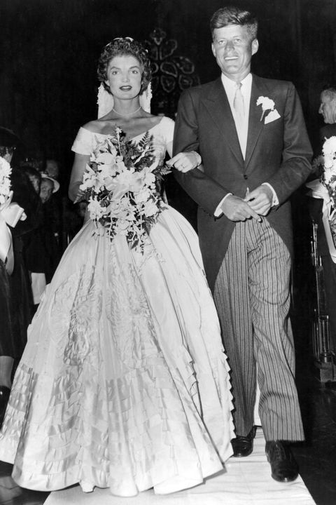 senator john fitzgerald kennedy 1917   1963, democratic senator for massachusetts, escorts his bride jacqueline lee bouvier 1929   1994 down the church aisle shortly after their wedding ceremony at newport, rhode island   photo by keystonegetty images