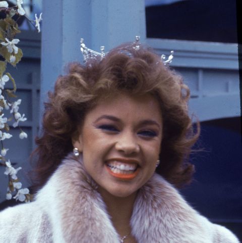 american model and actor vanessa williams, the first african   american miss america, smiles while appearing in the macys thanksgiving day parade, november 24, 1983 she wears her crown and a mink coat photo by tom gatesgetty images