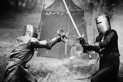 two knights in metal masks duel in a scene from the medieval comedy, monty python and the holy grail, directed by terry gilliam and terry jones, 1975 photo by columbia tristarcourtesy of getty images