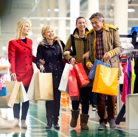 Family carrying shopping bags in mall family carrying shopping bags in mall