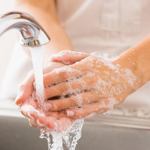 Caucasian woman washing her hands