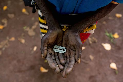 Cutter Anna-Moora Ndege shows the razorblade she uses to cut girls' genitals , on June 25, 2015, in Mombasa, Kenya. THESE are the rudimentary tools used to cut young girls sexual organs in remote villages in Kenya. The cruel practice of female genital mutilation (FGM) is illegal in the UK and in dozens of countries in Africa. But in remote Kenyan villages and communities far from the capital, Nairobi, the practice is very much alive and well.