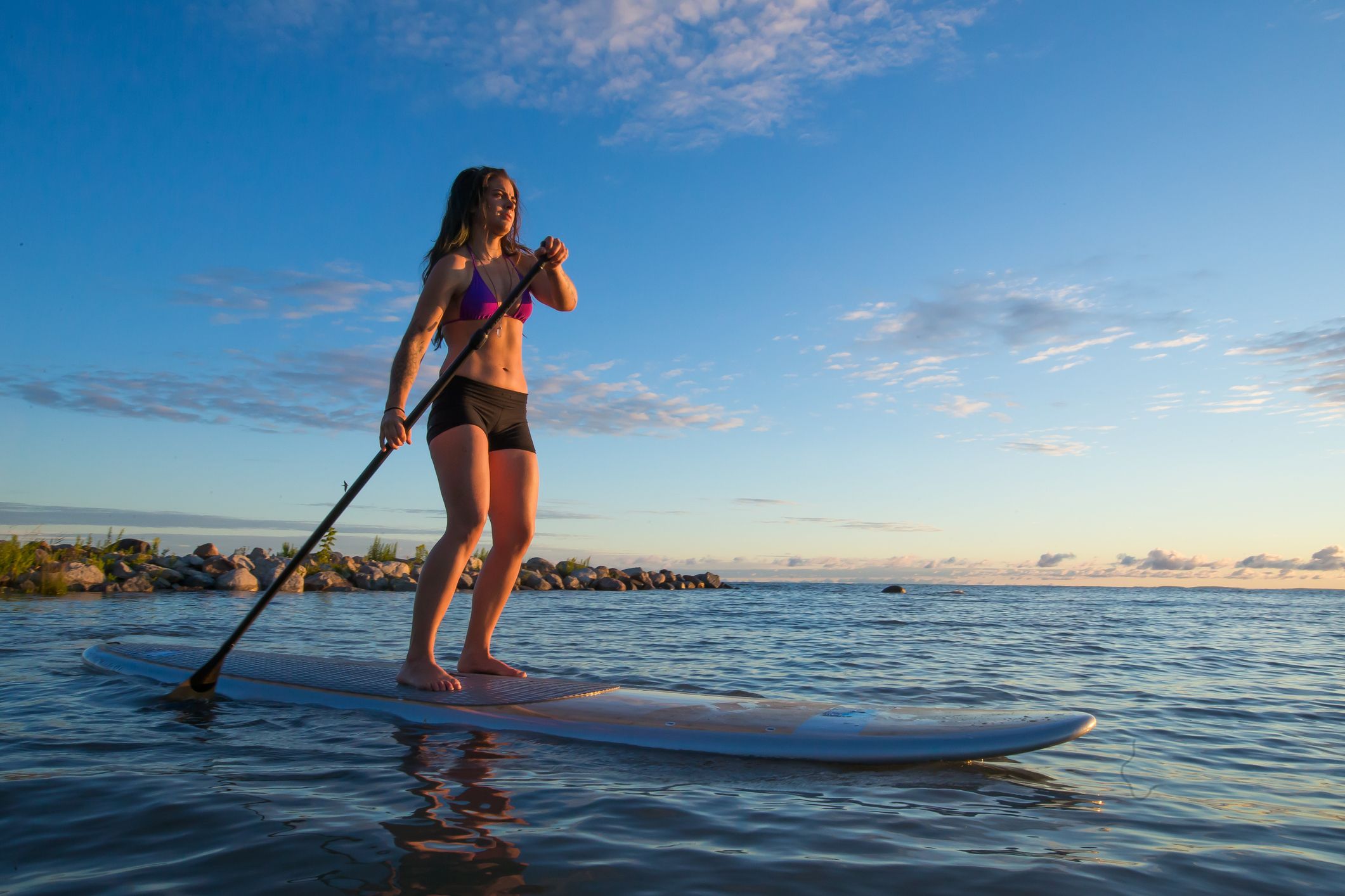 The Beginner’s Guide to Paddle Boarding, a Fun Way to Cross-Train This Summer
