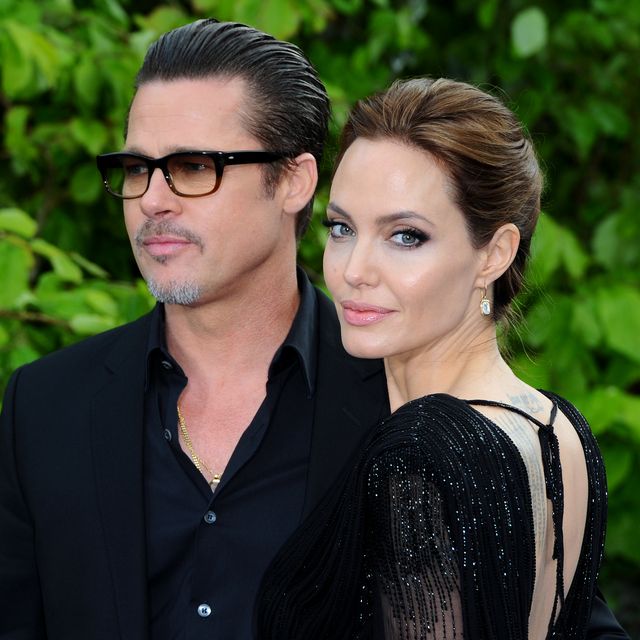 london, england   may 08  brad pitt and angelina jolie attend a private reception as costumes and props from disneys maleficent are exhibited in support of great ormond street hospital at kensington palace on may 8, 2014 in london, england  photo by anthony harveygetty images