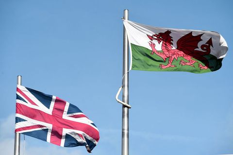 the welsh and union flag fly next to each other outside the national assembly building in cardiff on september 24, 2015 afp photo  damien meyer photo by damien meyer  afp photo by damien meyerafp via getty images