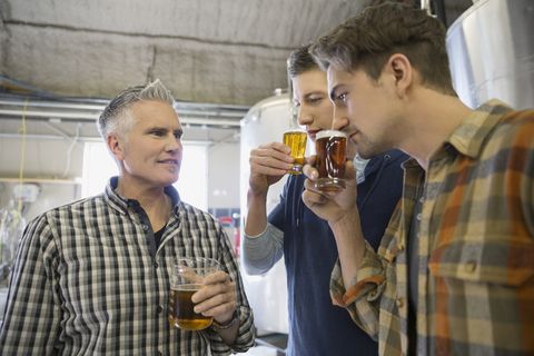 Men tasting beer at brewery