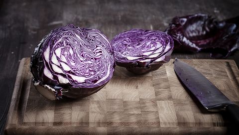 Sliced red cabbage on chopping board and knife