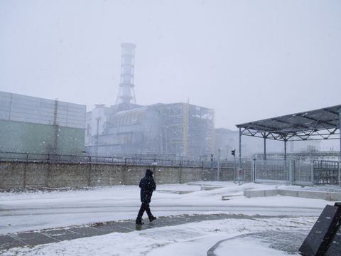 Worker walking in front of reactor 4
