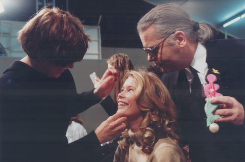 Top; while German-born Claudia Schiffer has her makeup applied; Chanel's designer Karl Lagerfeld sho