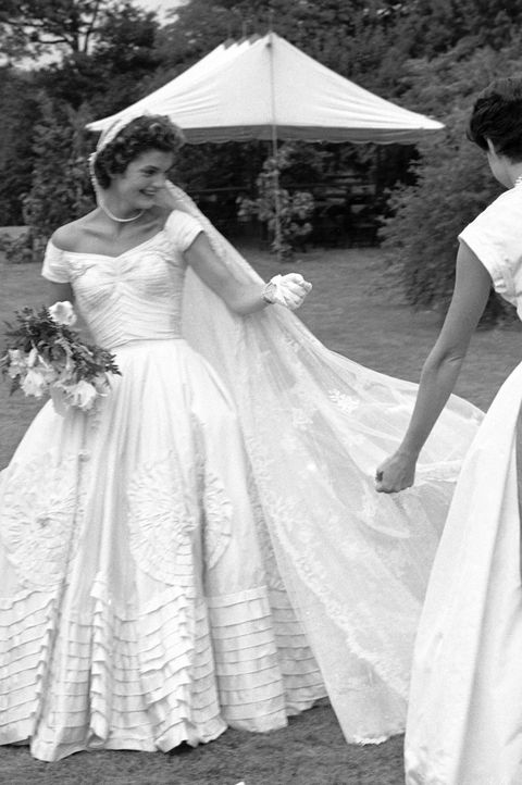 socialite jacqueline bouvier fixing veil of wedding dress outdoors at hammersmith farm on day of her marriage to sen john kennedy  photo by lisa larsenthe life picture collection via getty images