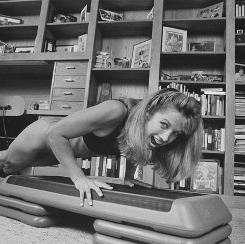 fitness guru denise austin doing a pushup on a step aerobic apparatus during routine in her home  photo by diana walkerthe life images collection via getty images